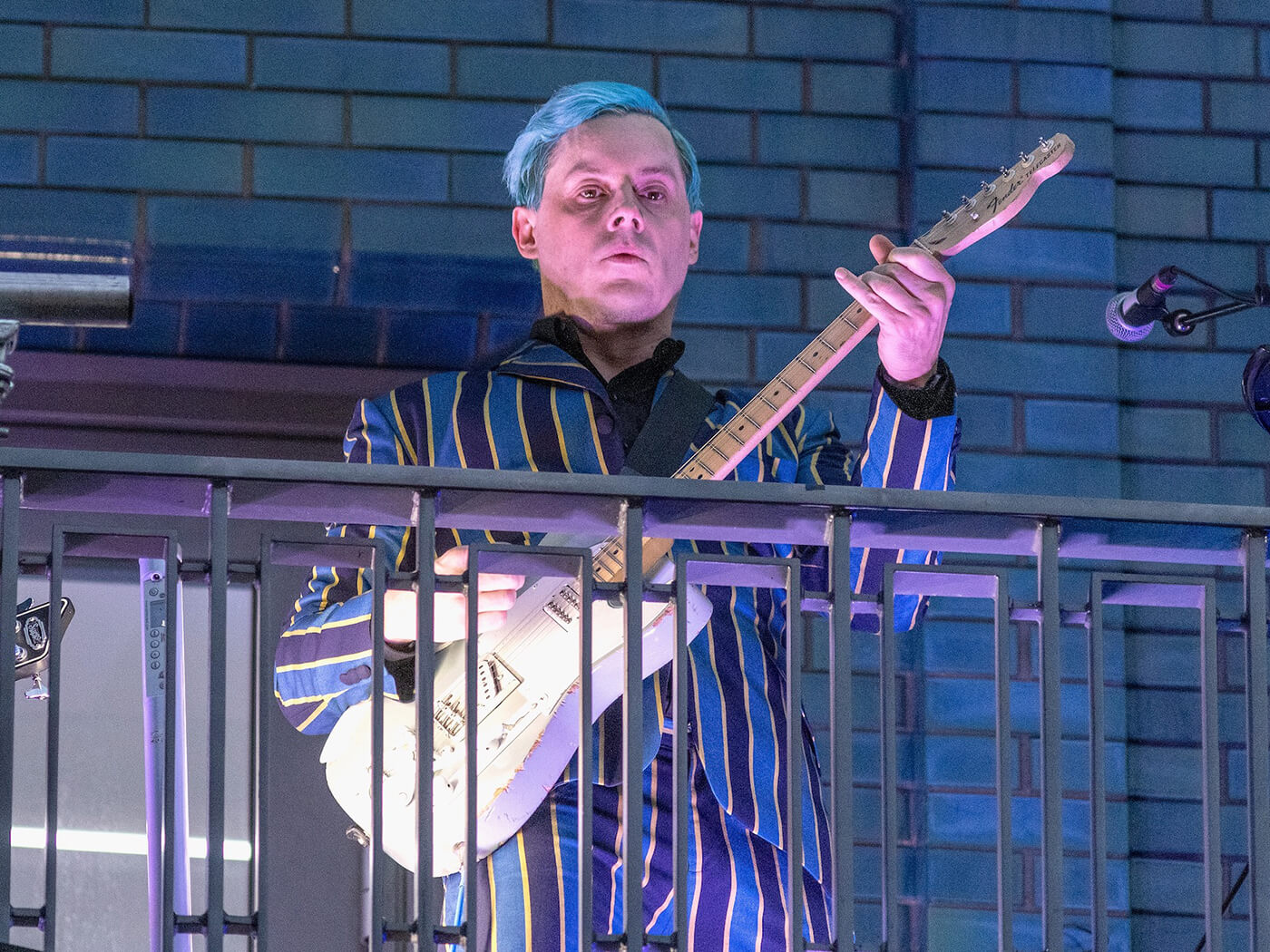 Jack White performs from a balcony on Marshall Street