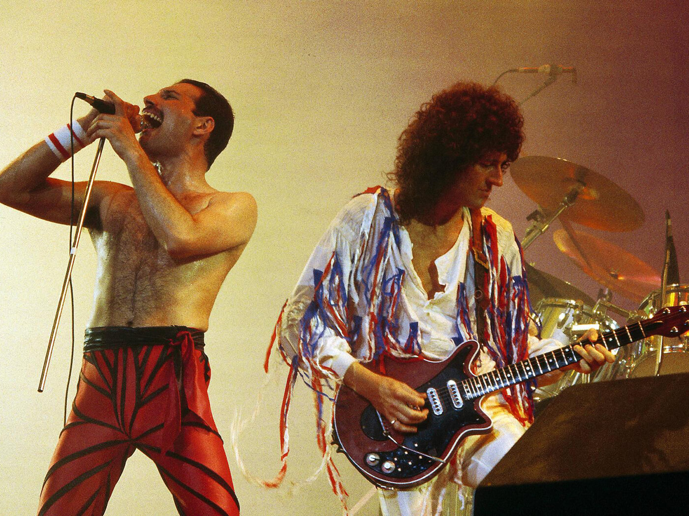 Freddie Mercury and Brian May of Queen perform live in 1985