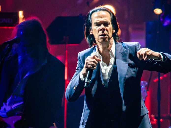 Nick Cave performing live on stage in 2022