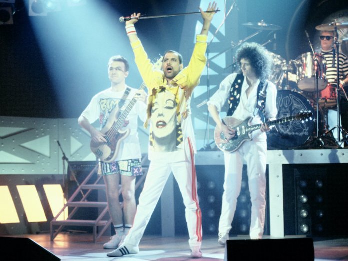 Queen performing live on-stage
